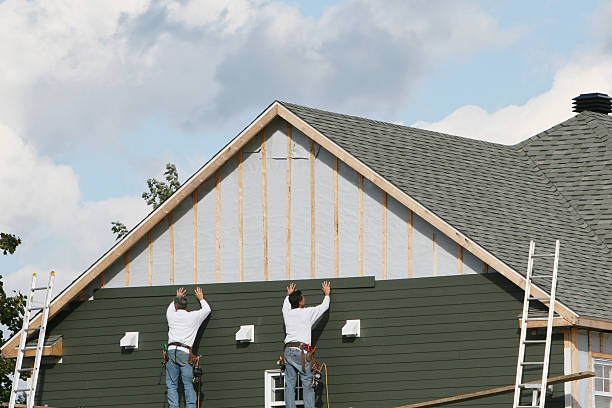 Professional Siding Contractor technician working in Port Jefferson, NY